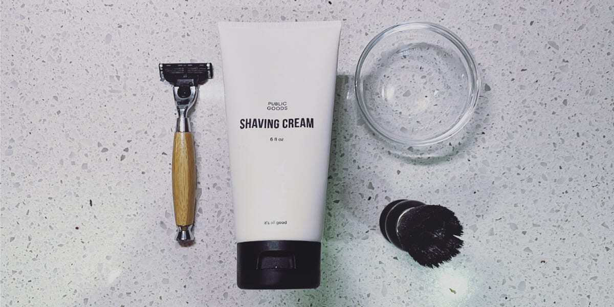 bamboo shaving razor and razor blade, public goods shaving cream, glass bowl, beard brush