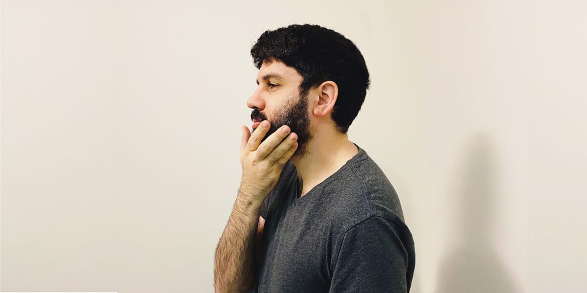 man lathering beard with shaving cream