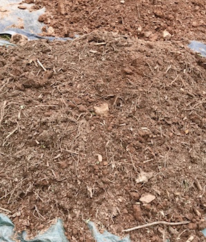 Top pile of soil from a grave.