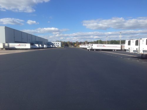 how long does asphalt take to cure, seal a new parking lot