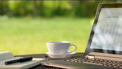 A laptop outdoors on a sunny day with glare on the screen.